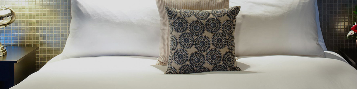 A Bed with Two Pillows